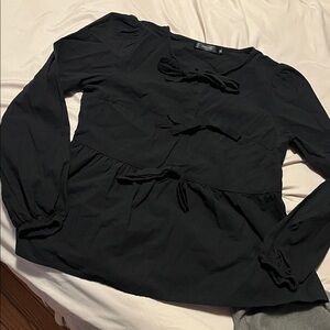 Black bow accent blouse size Medium. Never worn.